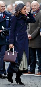 Duchess Meghan with Strathberry handbag