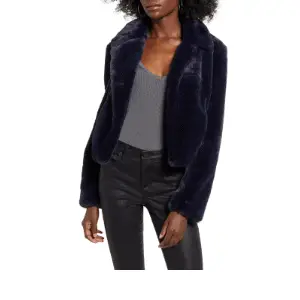 The cropped style of this faux fur coat puts a great emphasis on the waist line.